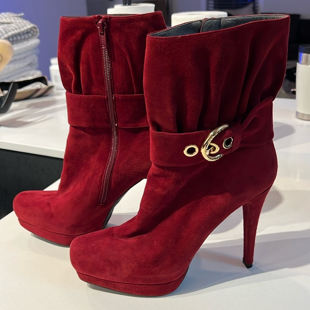 Stuart Weitzman high heeled booties with platform.